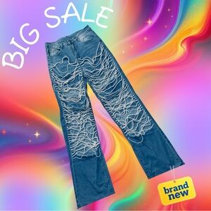 Elegant Blue Flare Jeans Ripped with Strings of White Pearl Accents inside